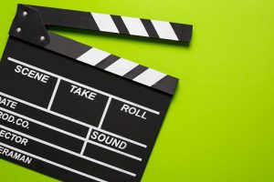 movie clapper on green background cinema