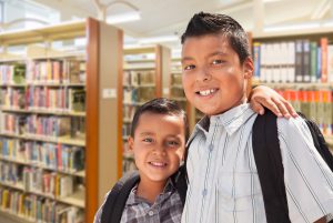 two young ELL boys in library